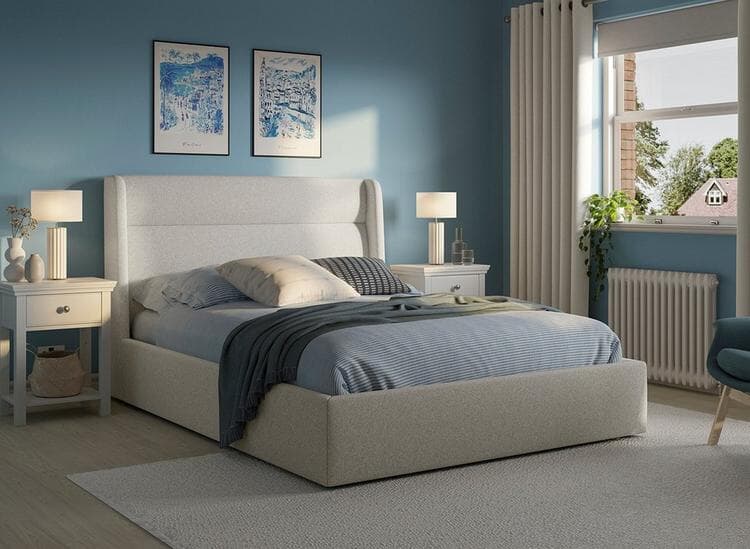 Grey Marcello Upholstered Ottoman Bed Frame in a Blue Bedroom
