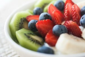Healthy breakfast of kiwi, strawberries, blueberries and banana