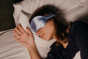 Woman sleeping with eye mask