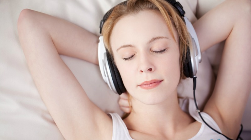 woman listening to music before bed